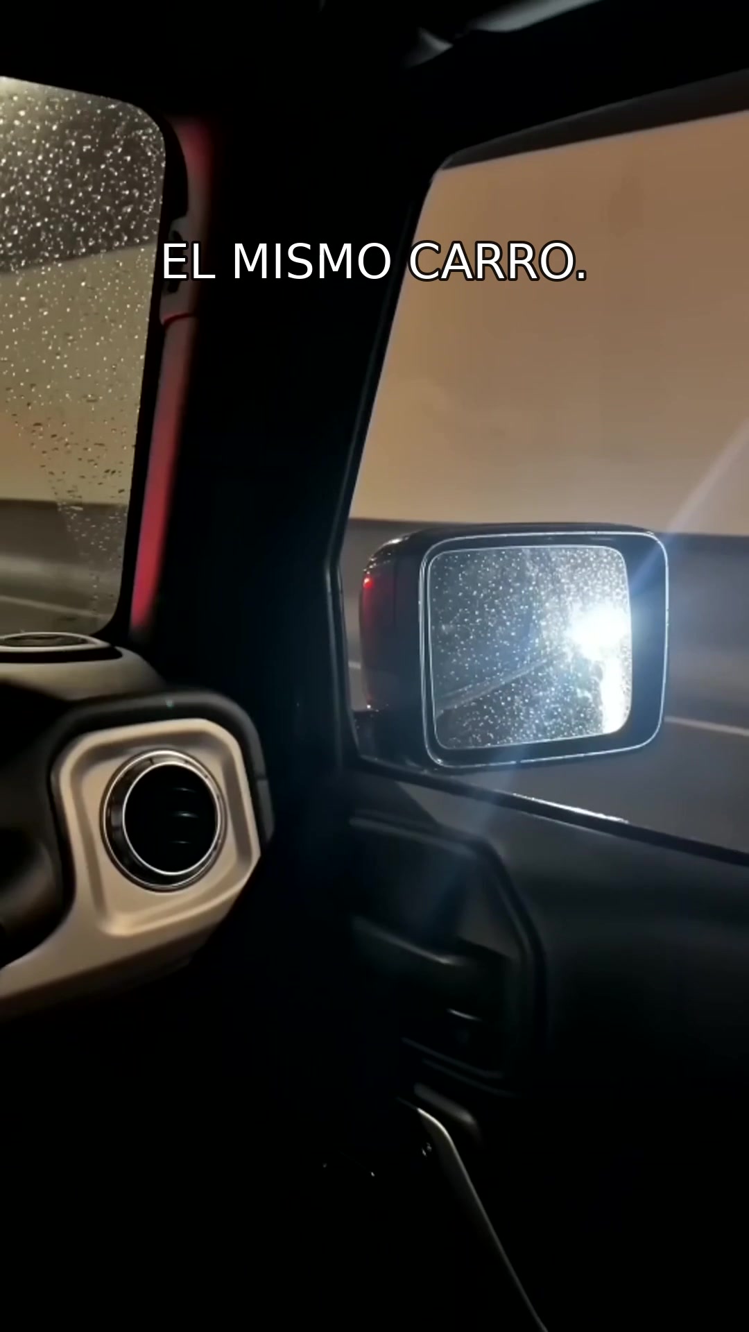 Rain and New York streetlights seen from inside the car